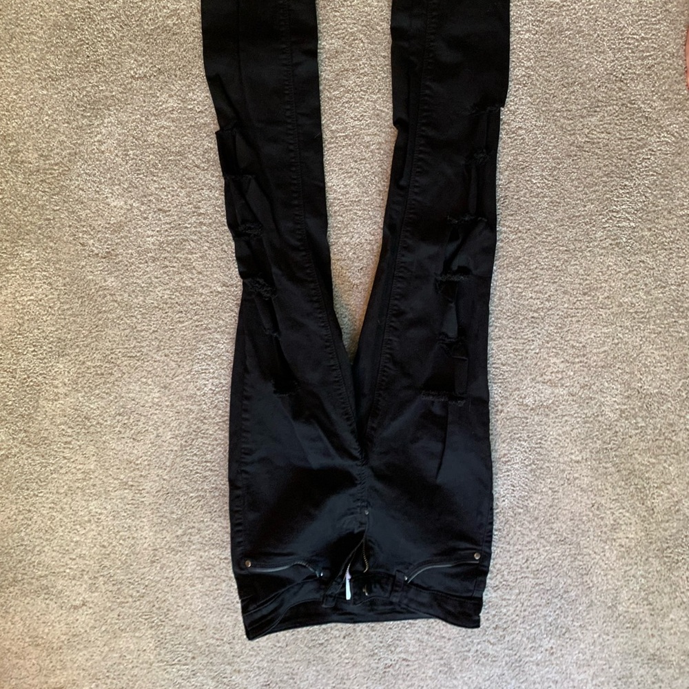 Women’s black ripped jeans